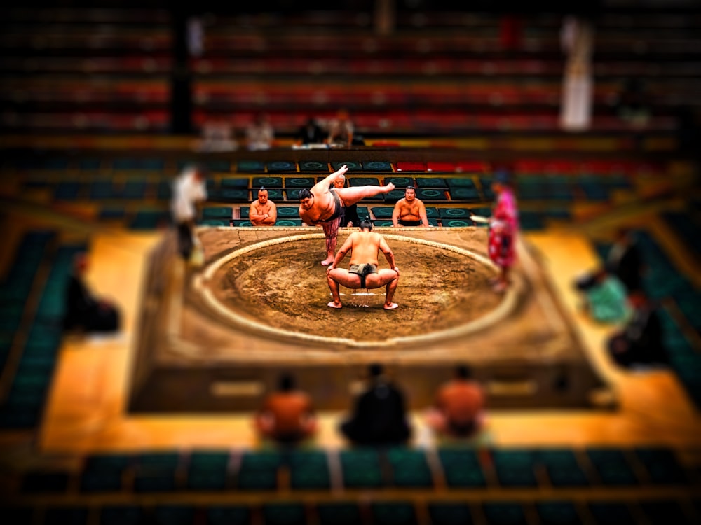 people playing on stadium during daytime