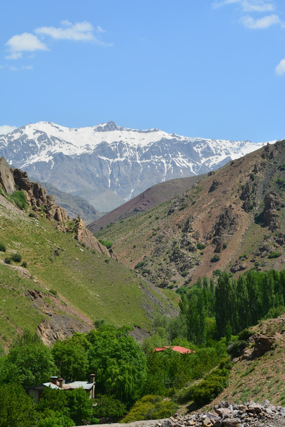 green and brown mountains under white clouds during daytime