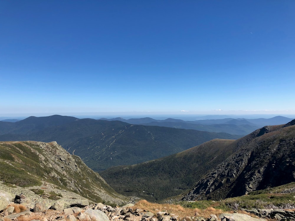 green and brown mountains under blue sky during daytime