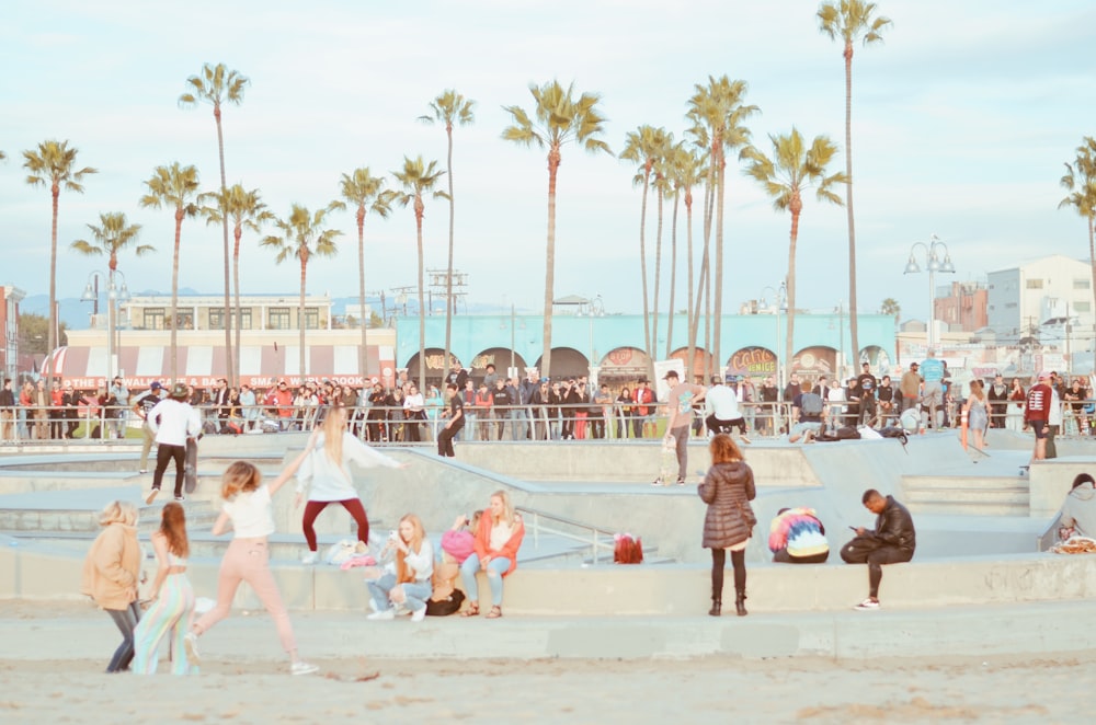 people playing basketball on ice field during daytime