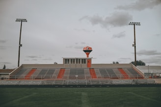 red and white stadium under cloudy sky during daytime