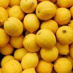 yellow citrus fruits on black surface