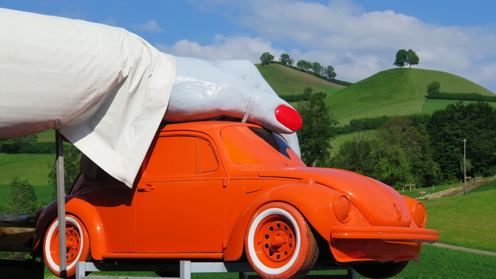 orange car with white textile on top