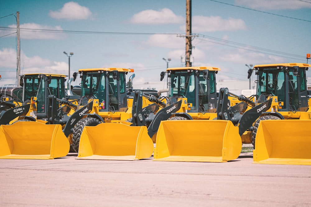 yellow and black heavy equipment on snow covered ground during daytime