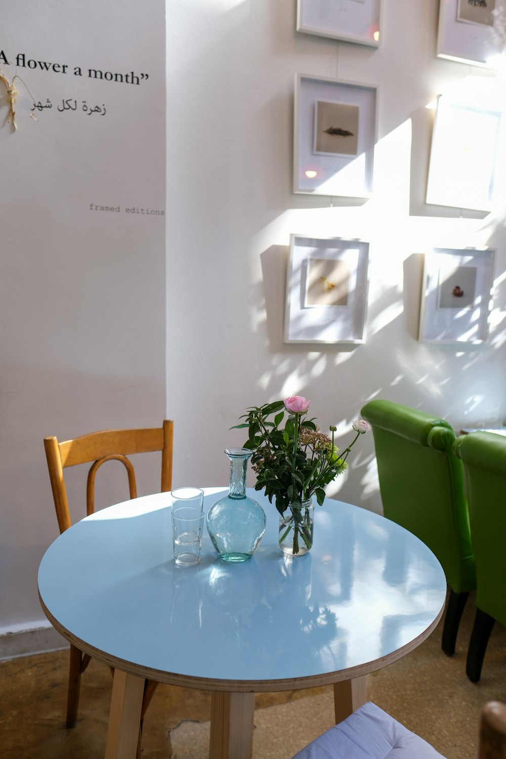 clear glass vase on white round table