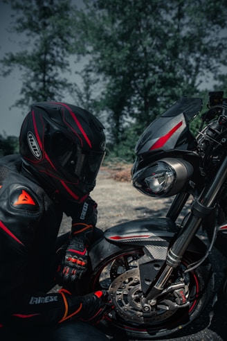 black motorcycle with helmet on motorcycle