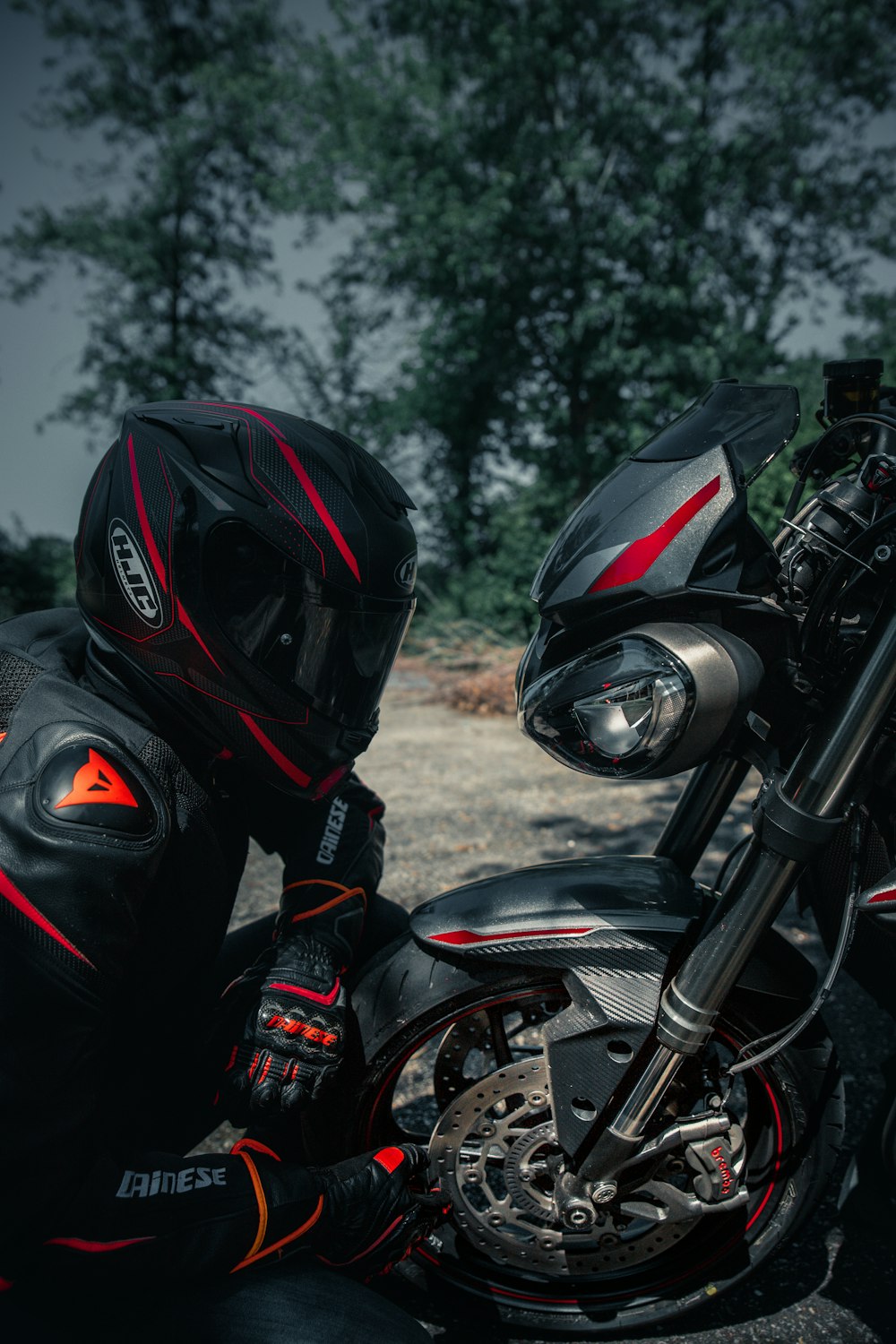 black motorcycle with helmet on motorcycle