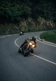 black sports bike on road during daytime