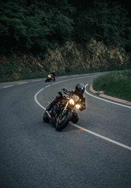 black sports bike on road during daytime