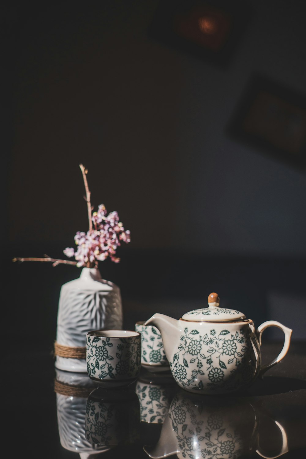 white and blue floral ceramic teapot