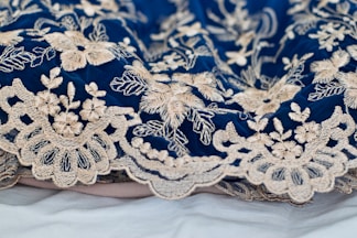 blue and white floral textile