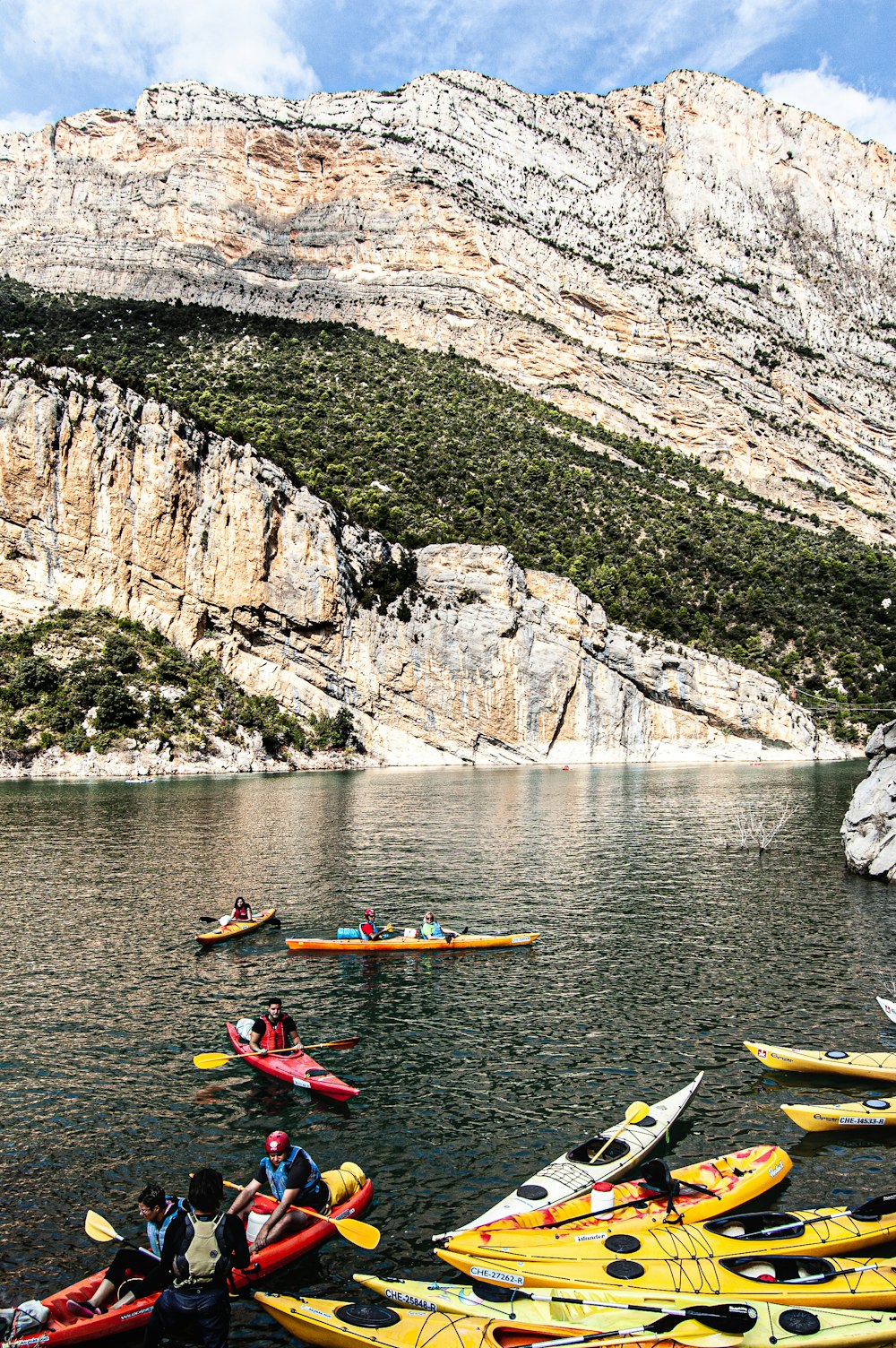 person riding on kayak on river during daytime