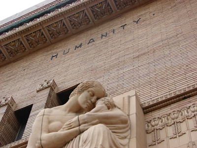 woman in dress concrete statue
