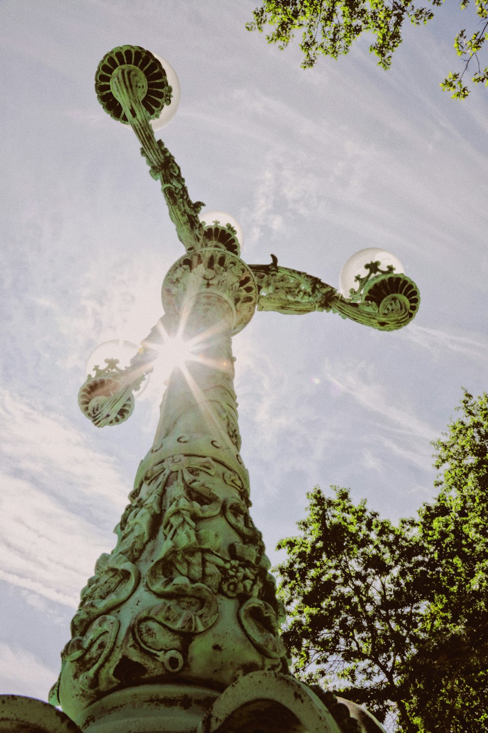 low angle photography of angel statue