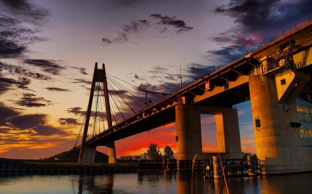 bridge over water during sunset