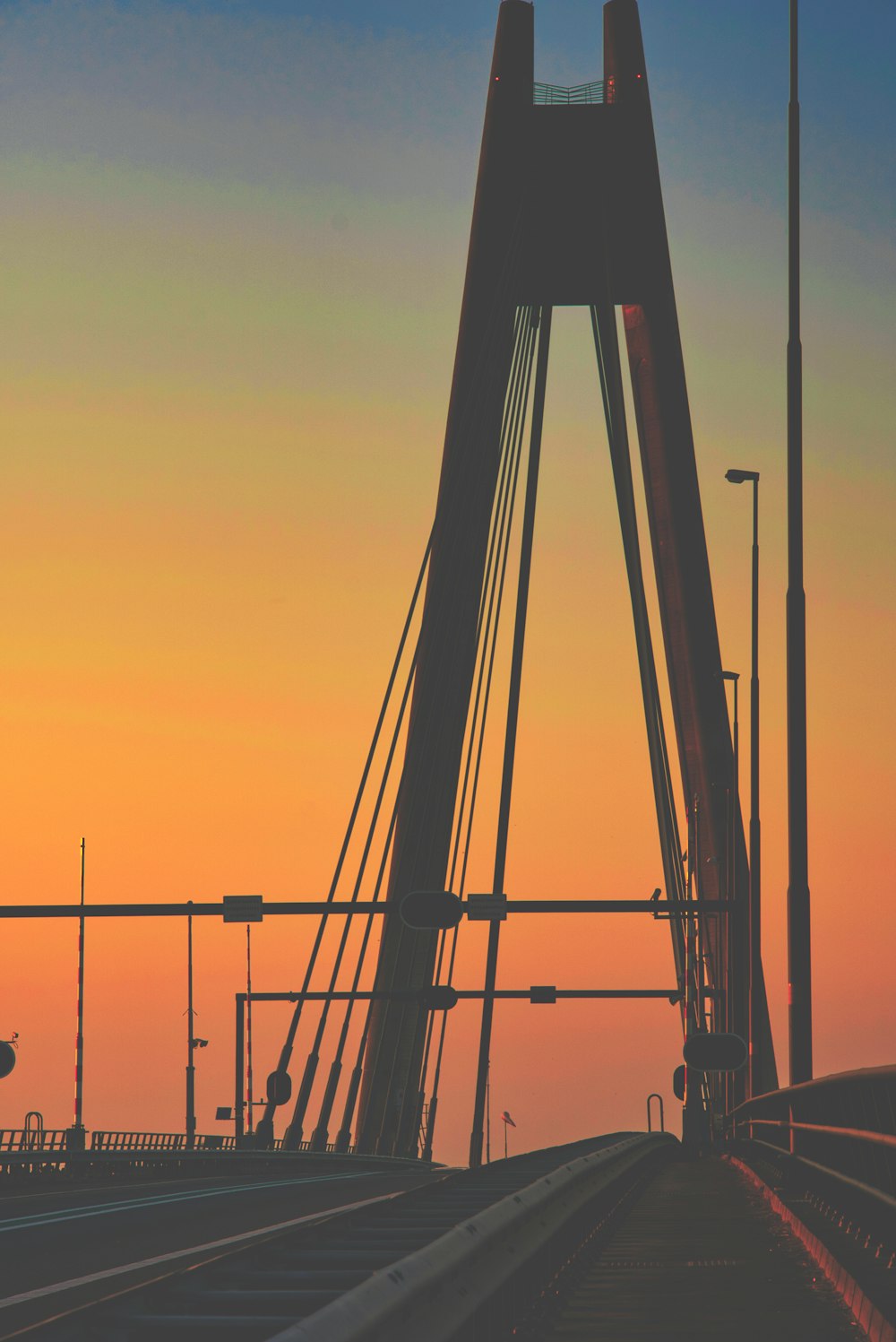 silhouette of a man on a tower during sunset