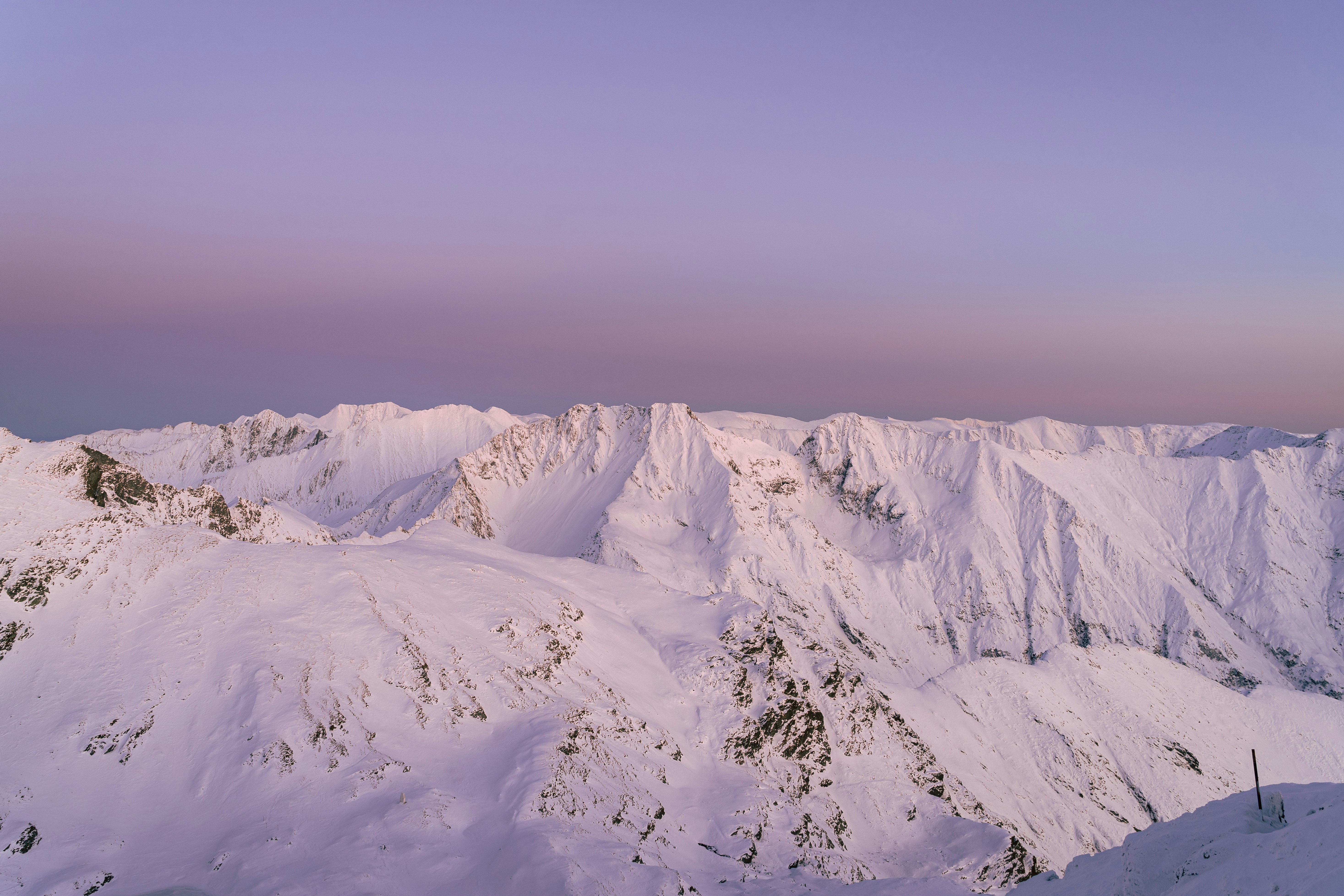snow covered mountain under blue sky during daytime
