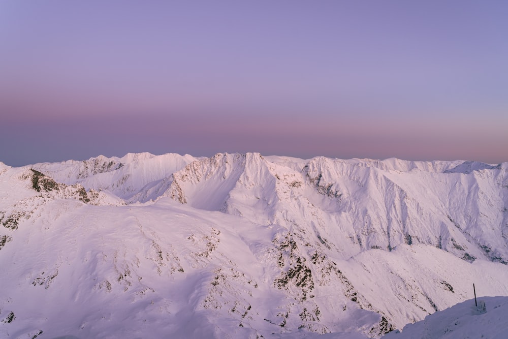 snow covered mountain under blue sky during daytime