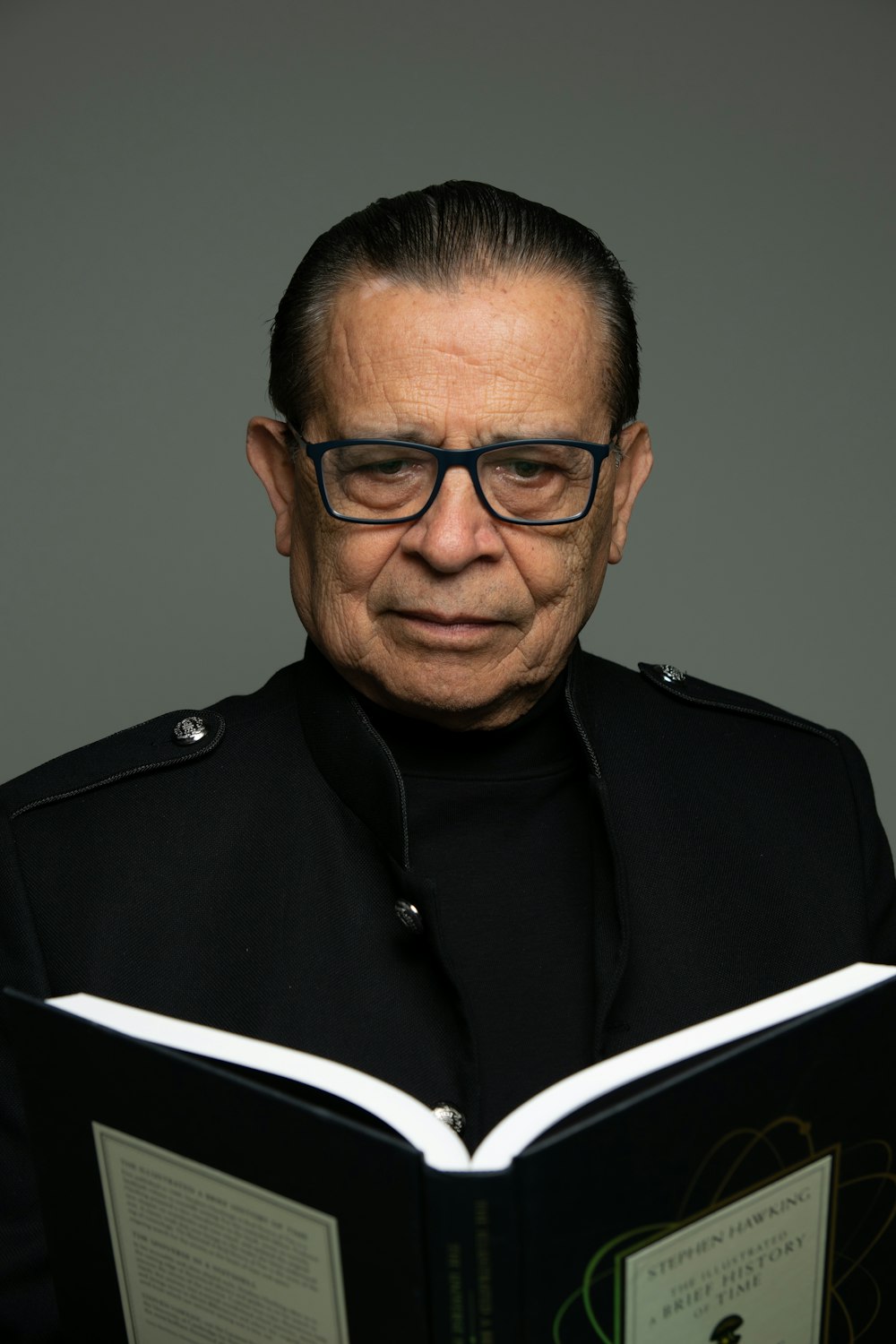 man in black button up shirt wearing eyeglasses