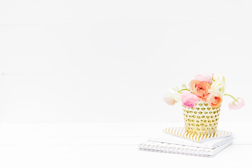 pink and white cupcake on white and brown polka dot tray