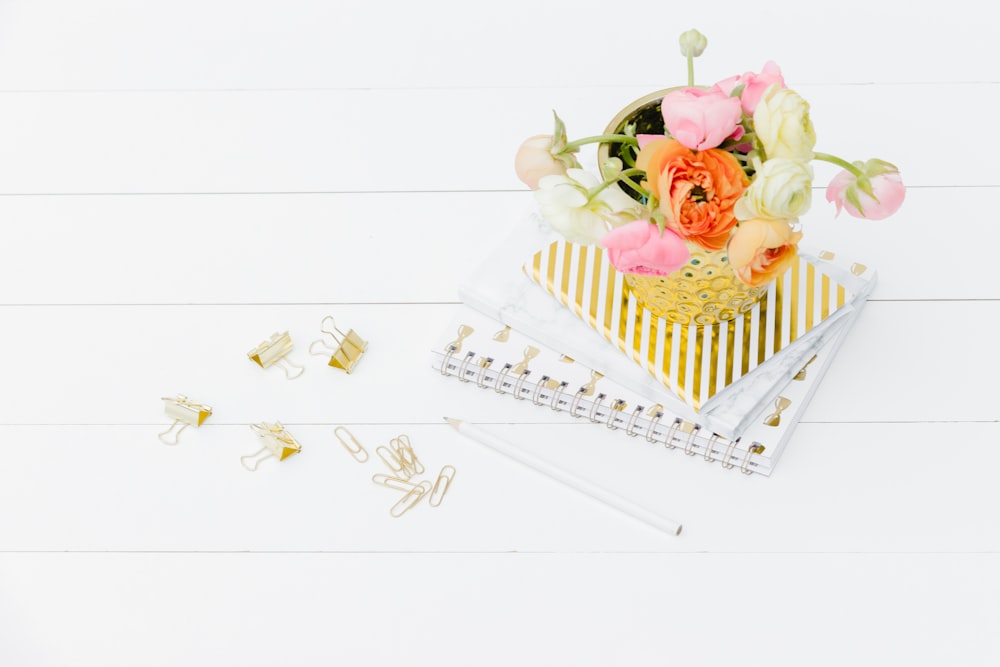 pink roses on white wooden basket