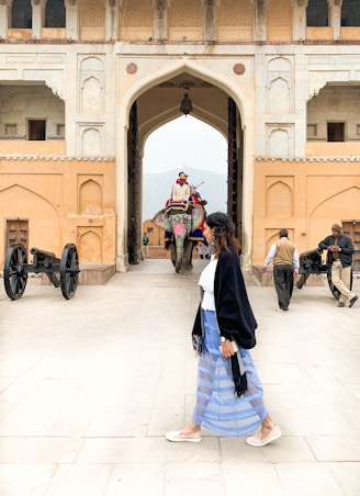 people walking on white floor tiles during daytime