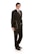 A person is wearing a formal black suit with a white shirt and a black tie, holding a closed laptop in one hand. The person is standing confidently and smiling, with their body slightly angled to the side against a white background.
