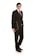 A person is wearing a formal black suit with a white shirt and a black tie, holding a closed laptop in one hand. The person is standing confidently and smiling, with their body slightly angled to the side against a white background.