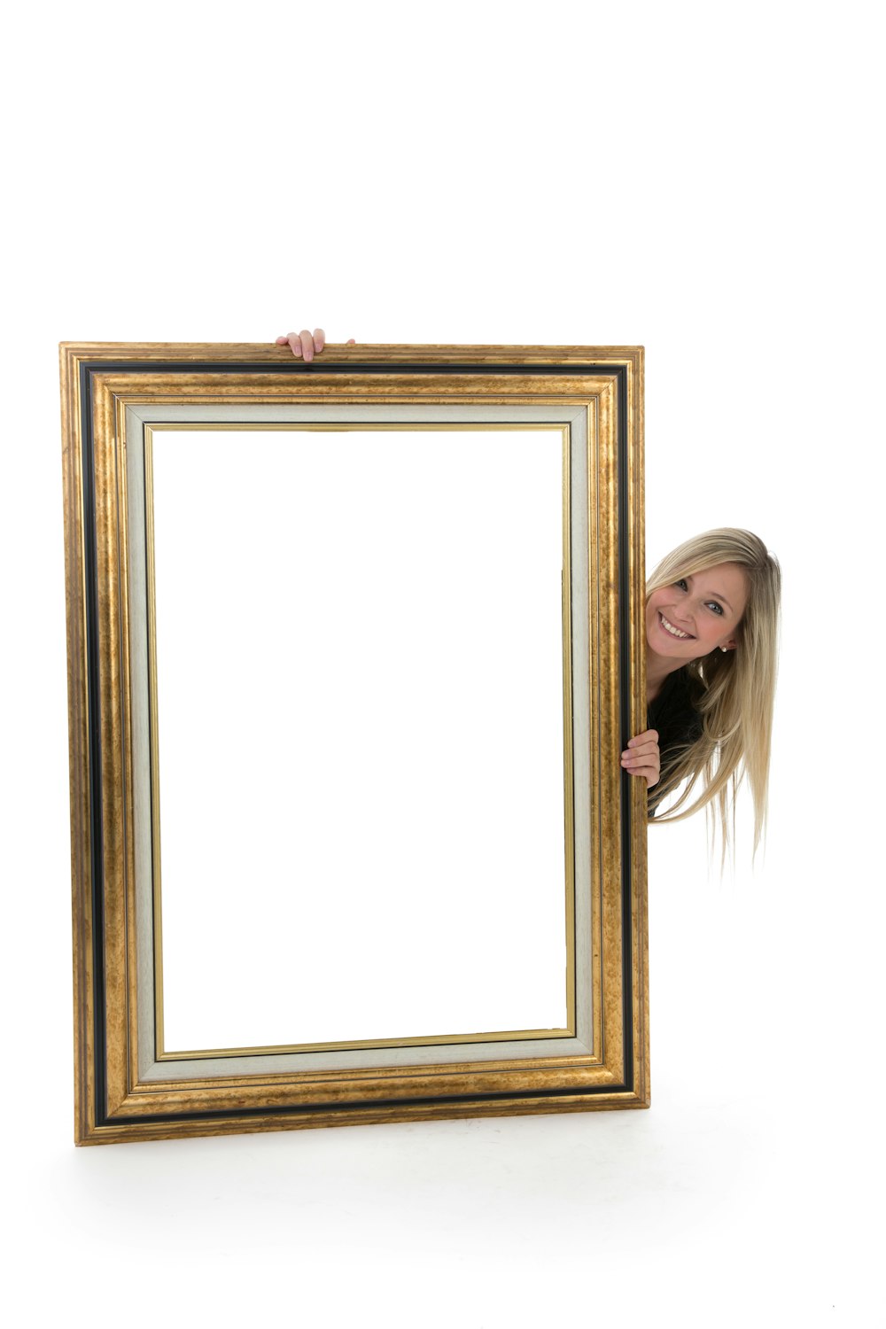 woman in black shirt standing beside brown wooden frame