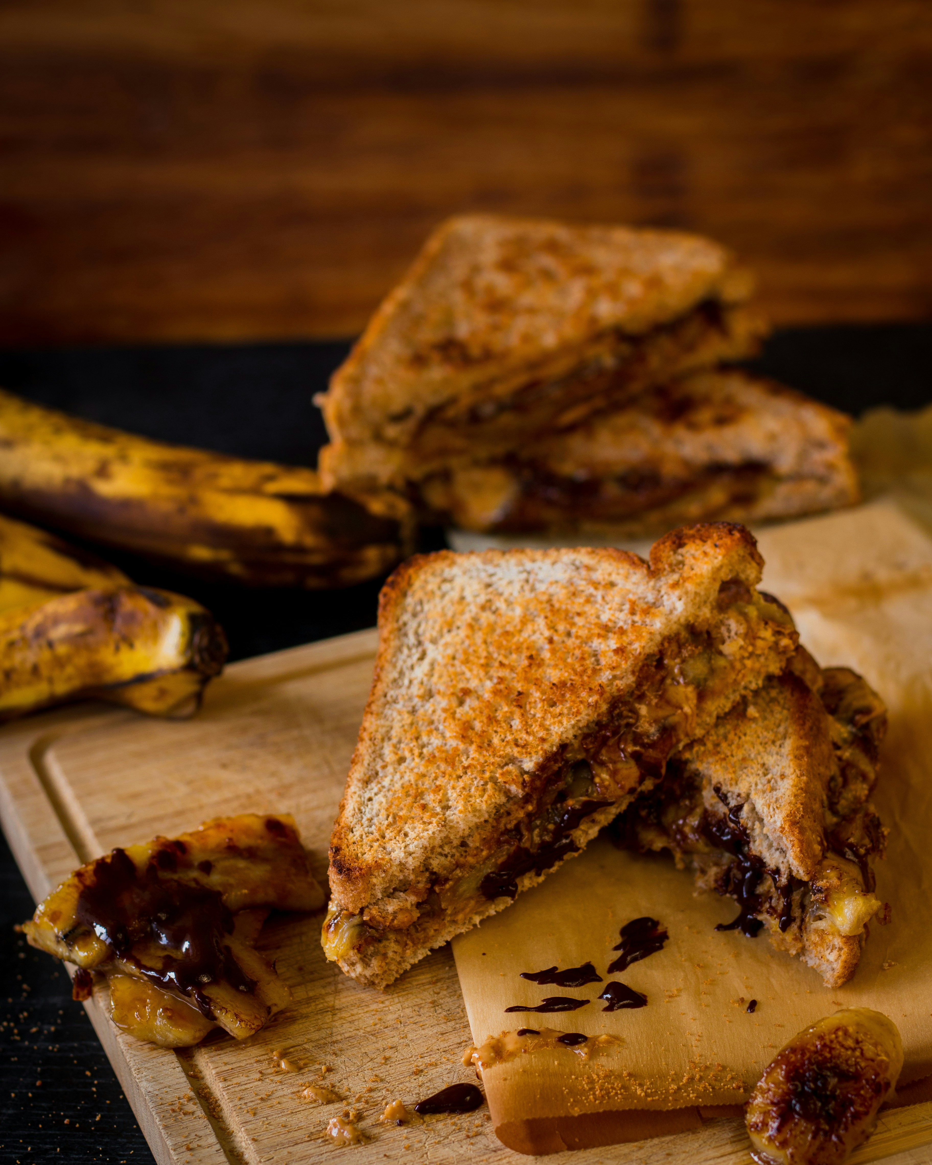 sliced bread on brown wooden chopping board