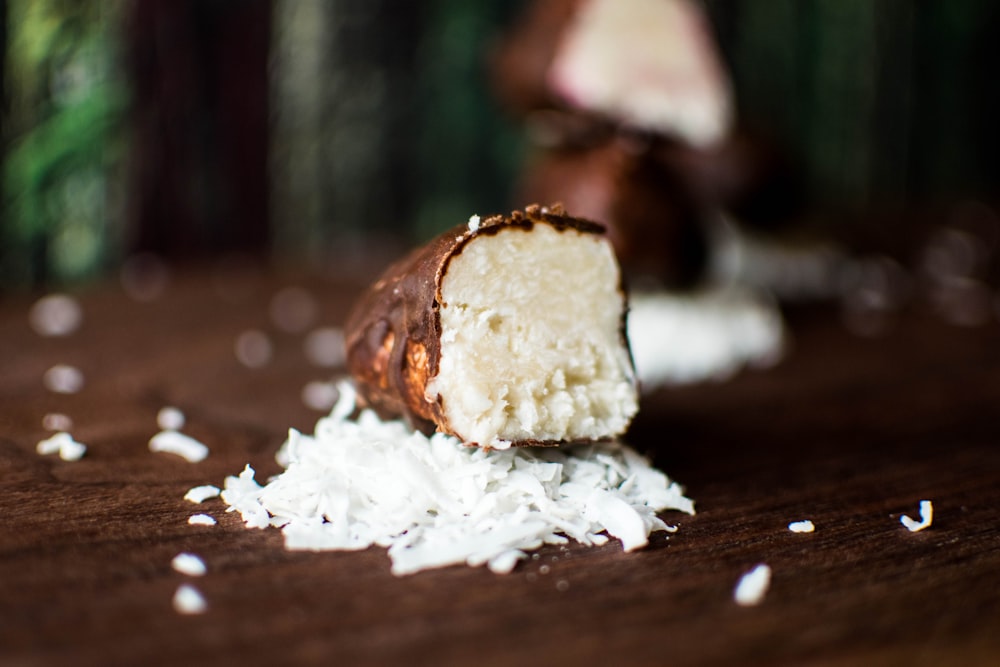 brown bread with white powder on brown wooden table