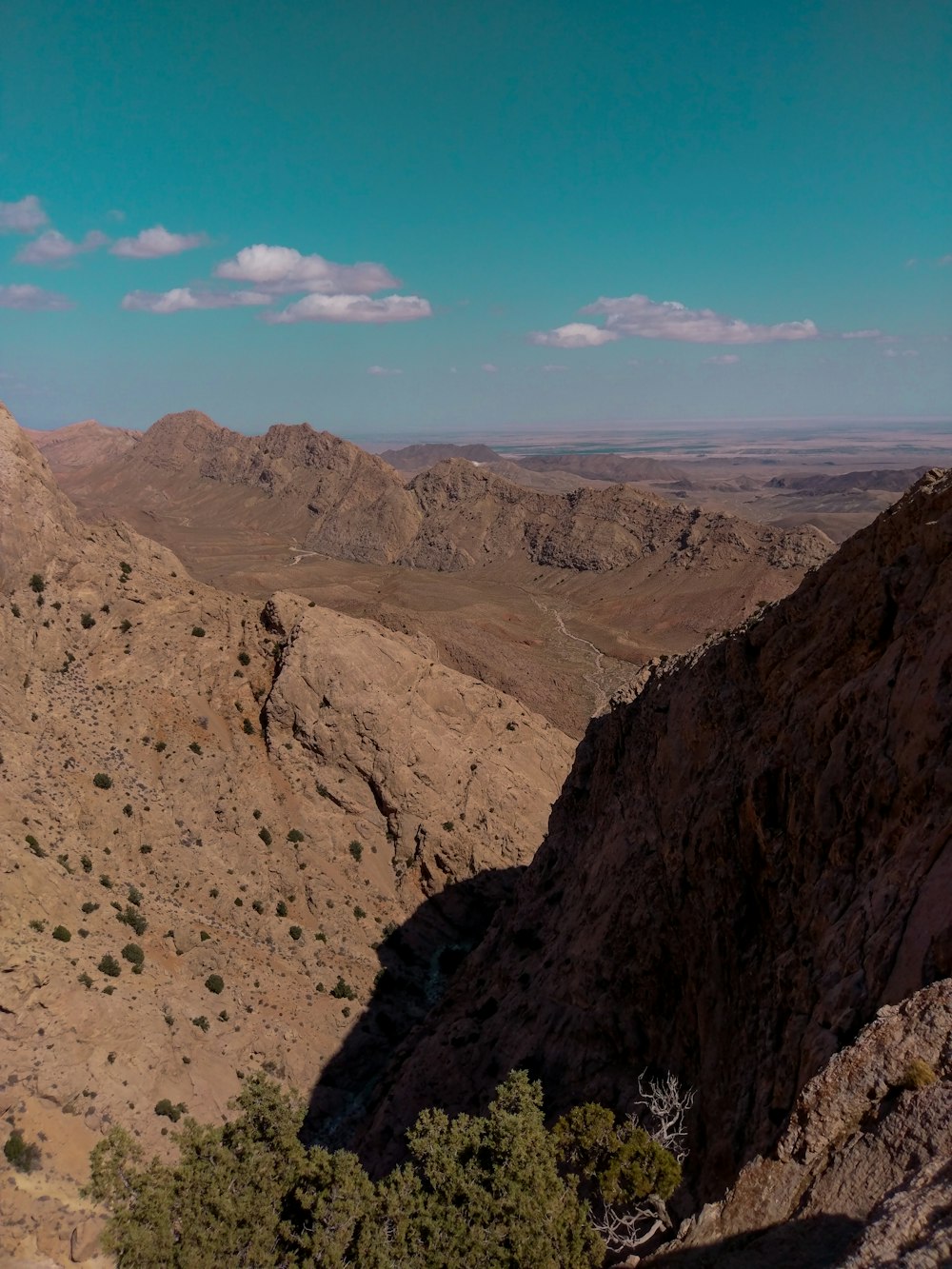 brown rocky mountain under blue sky during daytime