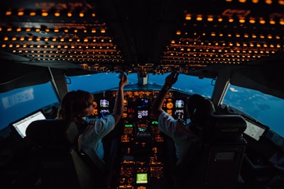 woman in white shirt sitting on airplane seat