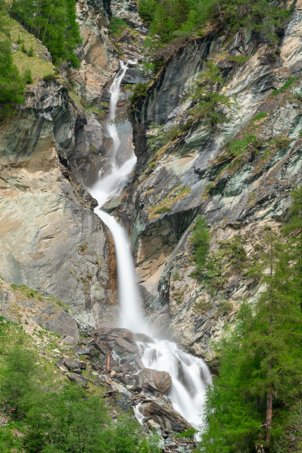 water falls on rocky mountain