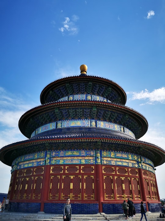brown and blue round building in Temple of Heaven China
