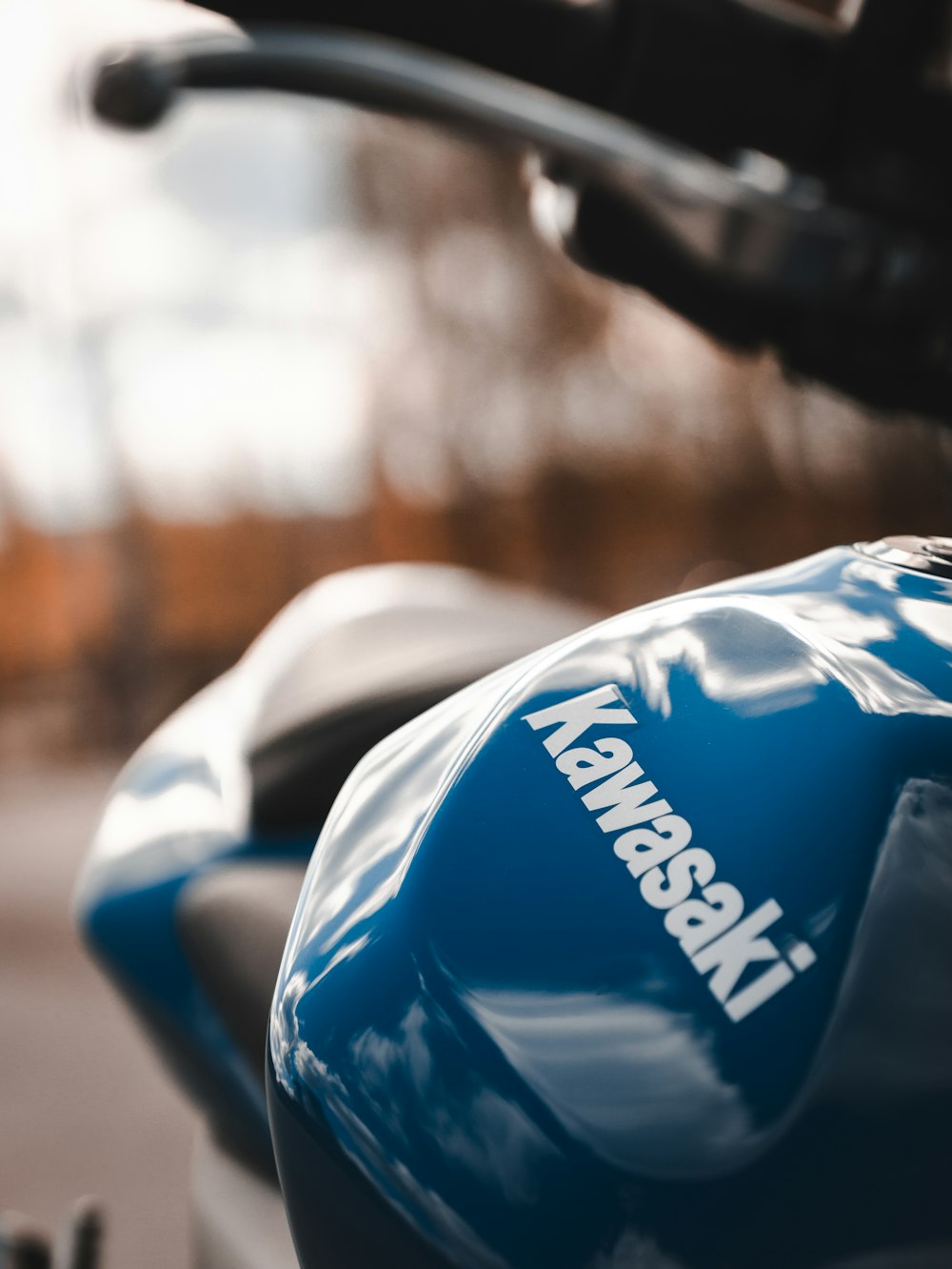 a close up of a blue and black motorcycle