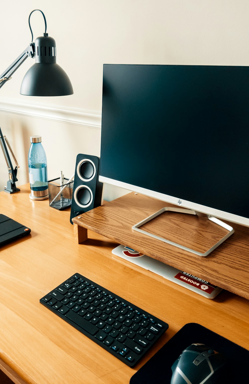 black computer keyboard beside gray flat screen computer monitor