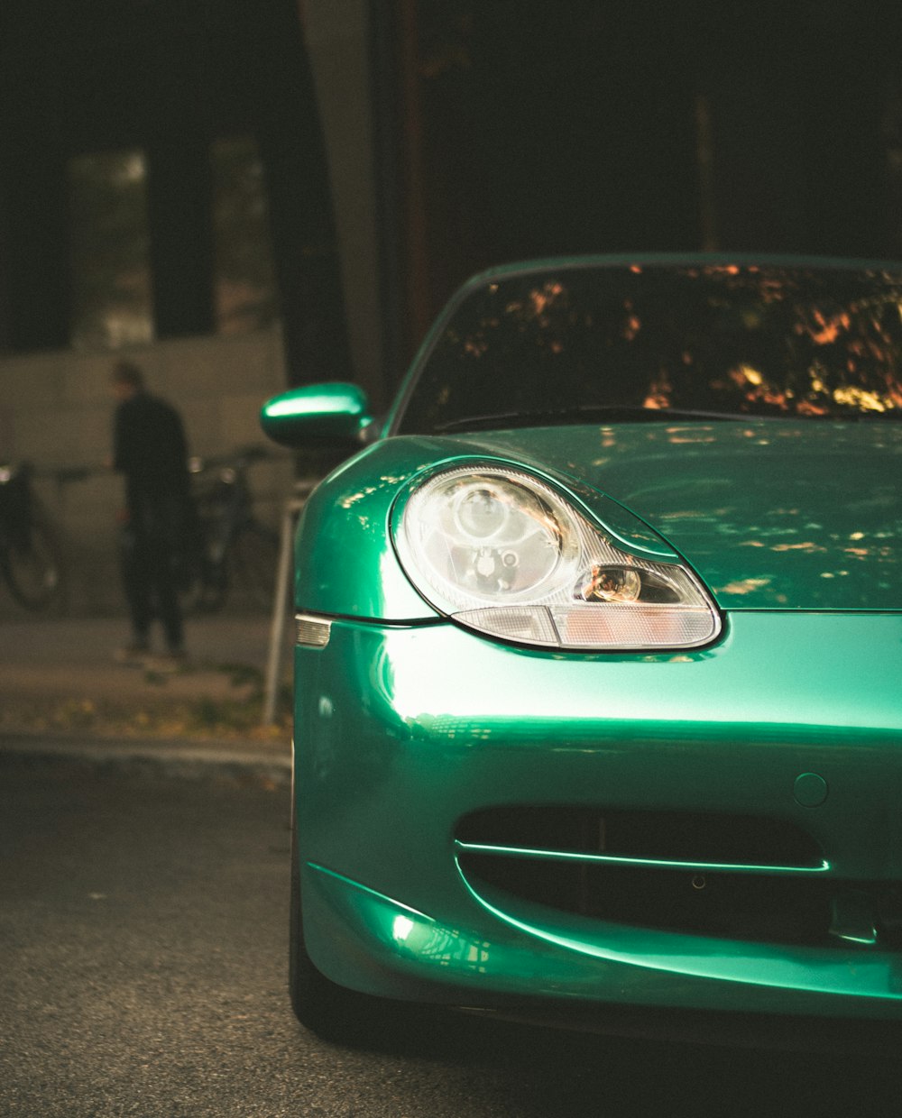 green car on the road during night time