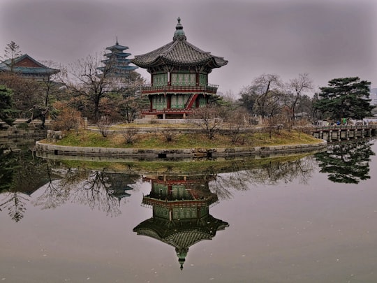 green and brown pagoda temple near lake in Gyeongbokgung South Korea