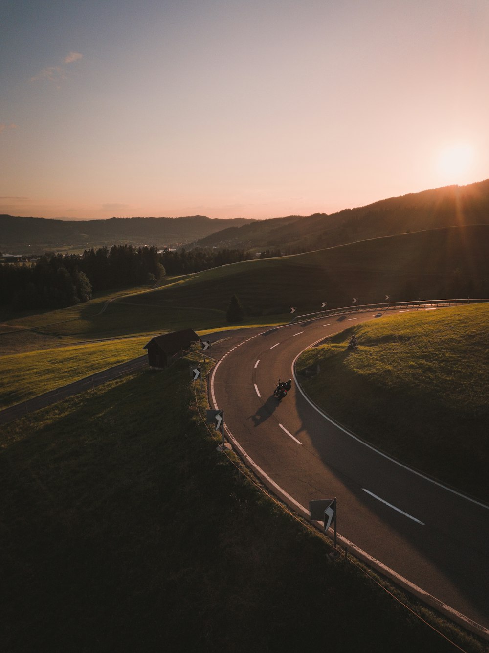 black car on road during sunset