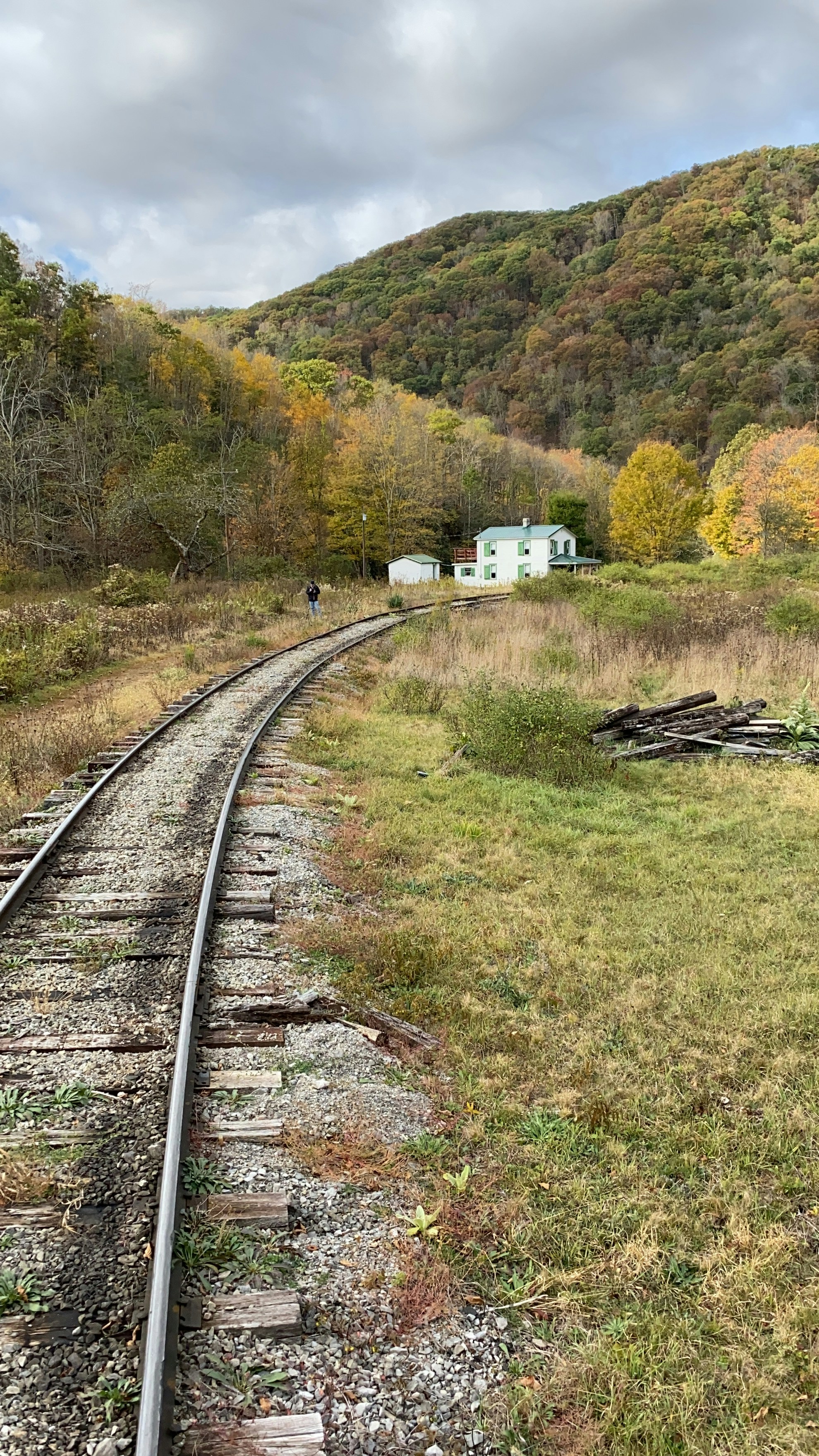 A train track in the middle of a field photo – Free Building Image on ...
