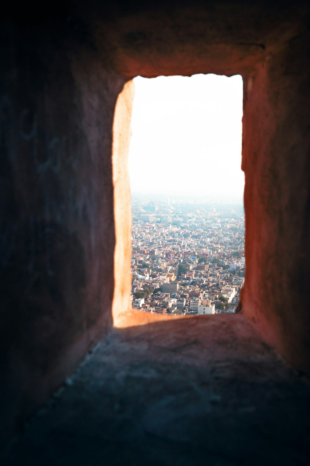 a view of a city from a window in a building