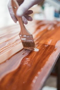 brown wooden handle brush on brown wooden table