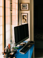black flat screen tv on brown wooden table