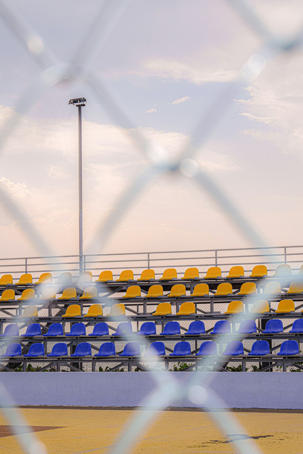 blue and yellow metal fence