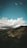 green and brown mountain under blue sky and white clouds during daytime