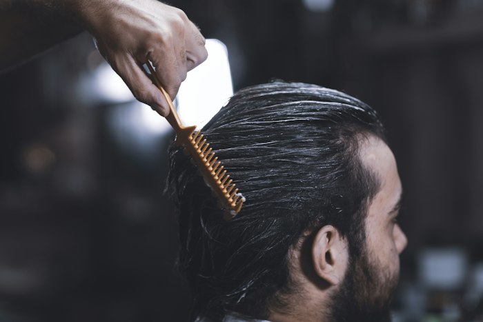 Comb through long hair before cutting