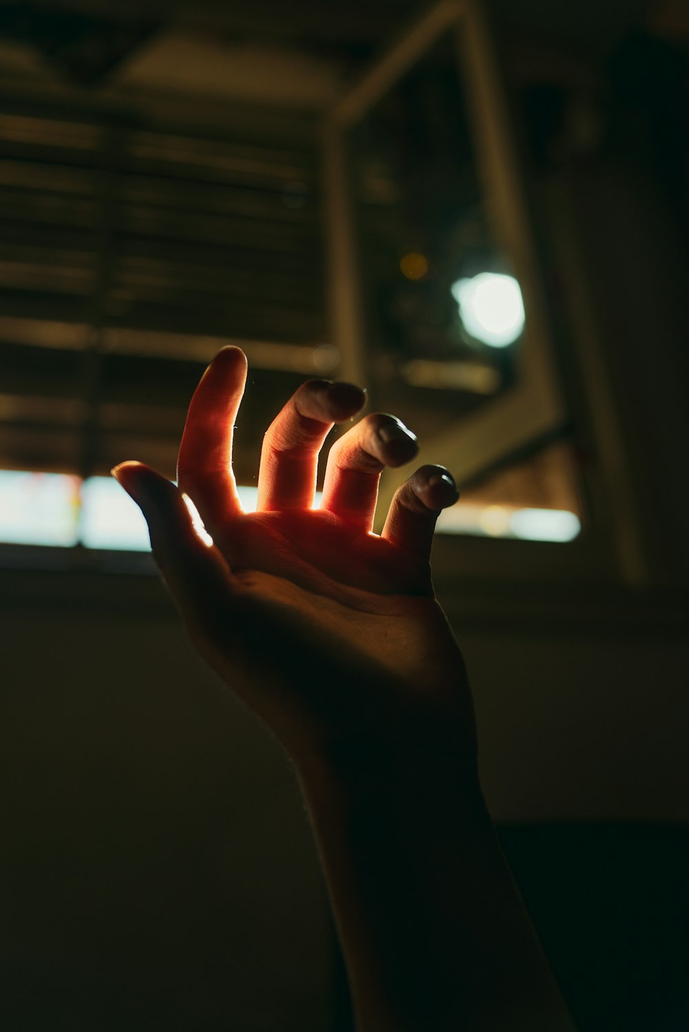 persons hand with light
