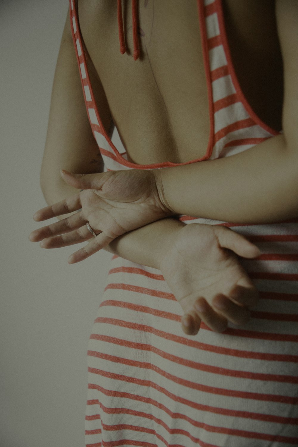 woman in red and white stripe tank top