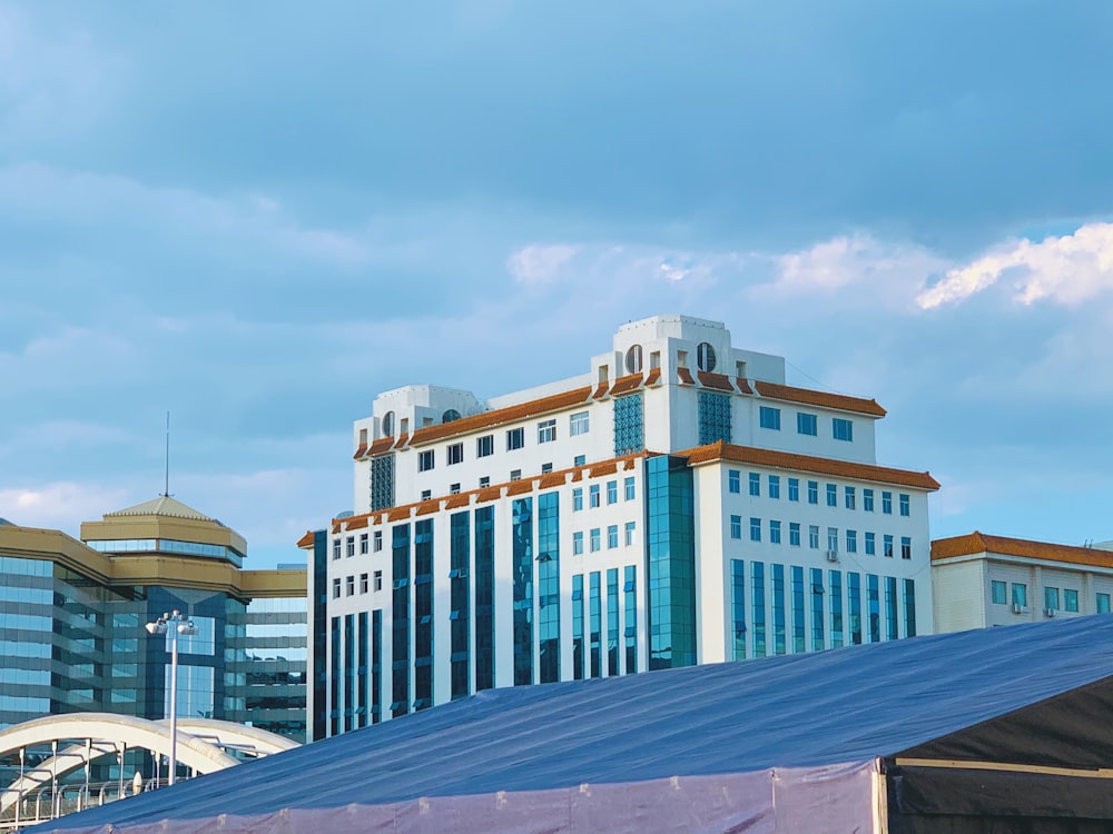 brown and green concrete building under blue sky during daytime